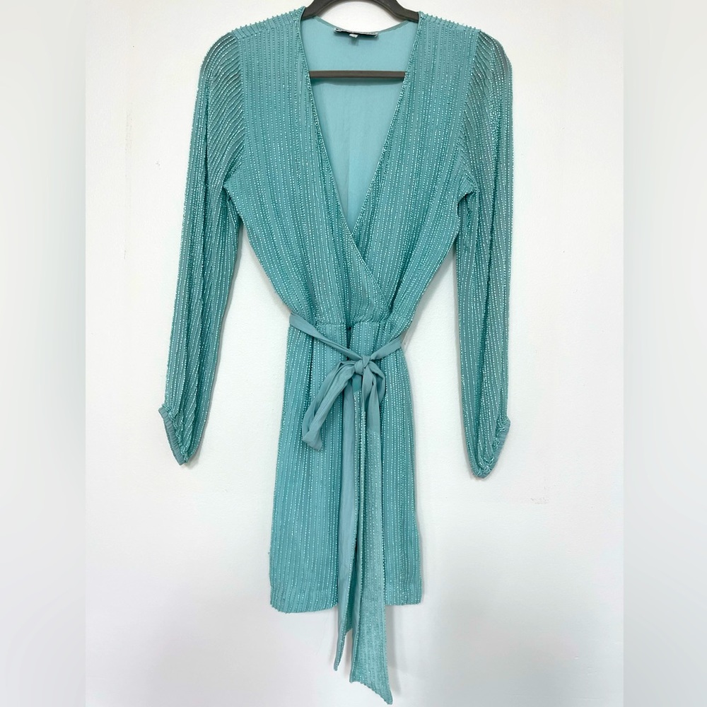 Teal short beaded dress.
